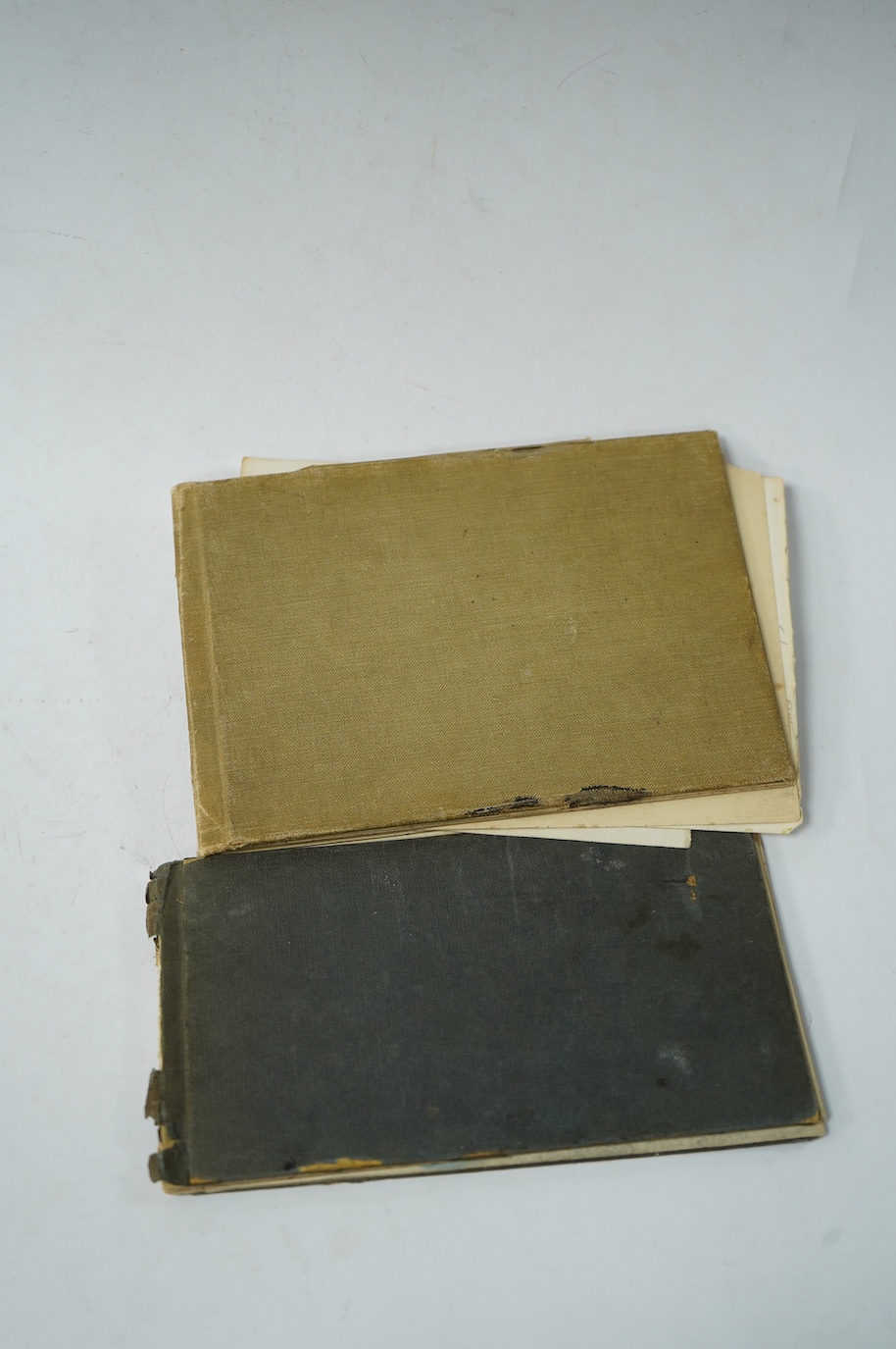 Two 20th century sketch books with watercolour, charcoal and paper sketches, some of Scottish landscapes and Art Deco portraits. Condition - fair